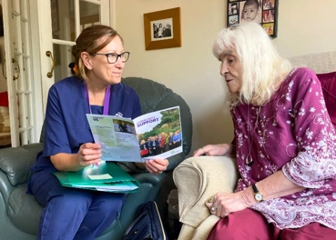 Community nurse with a patient in their home
