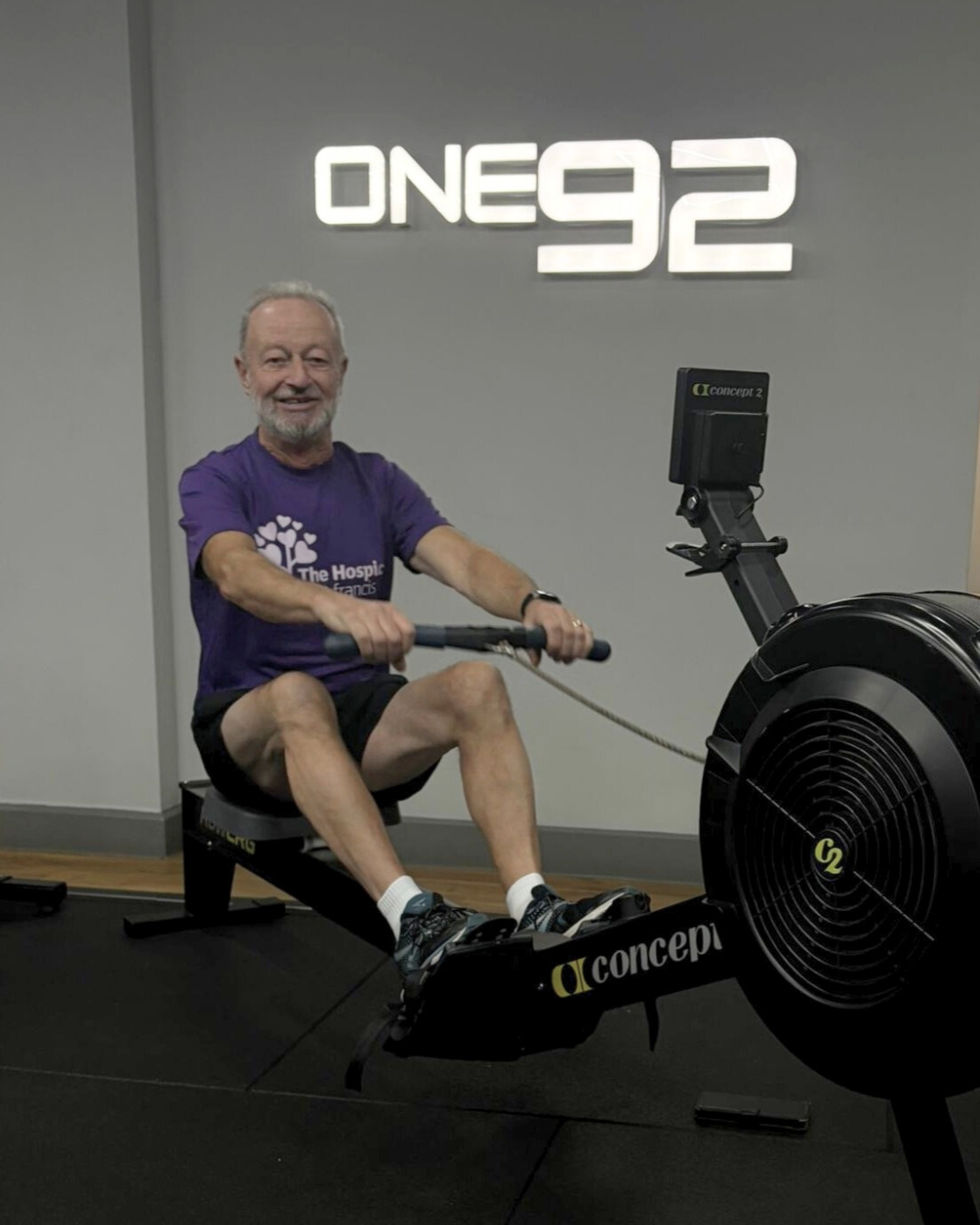 Man uses rowing machine