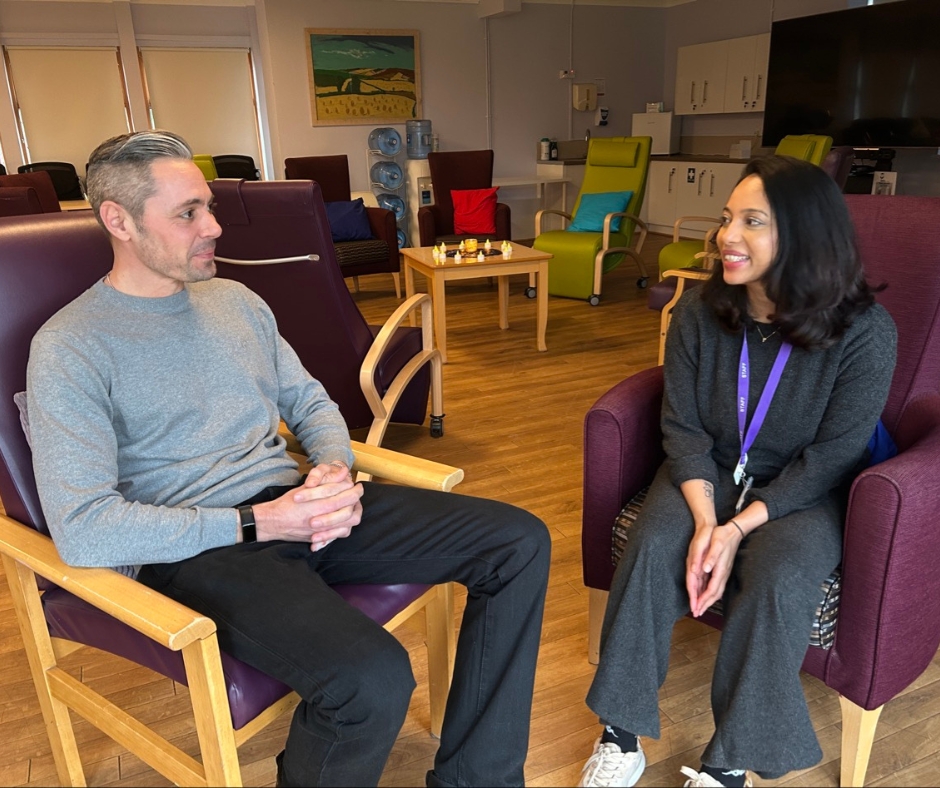 Adam and Priya sit together before a meditation session