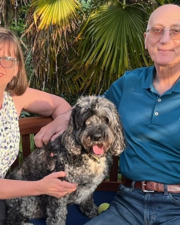 Christine and Dan sit with their dog